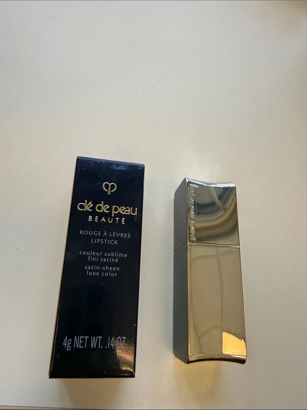 cle de peau beauty red Satin Lipstick in 103 Legend of Rouge
